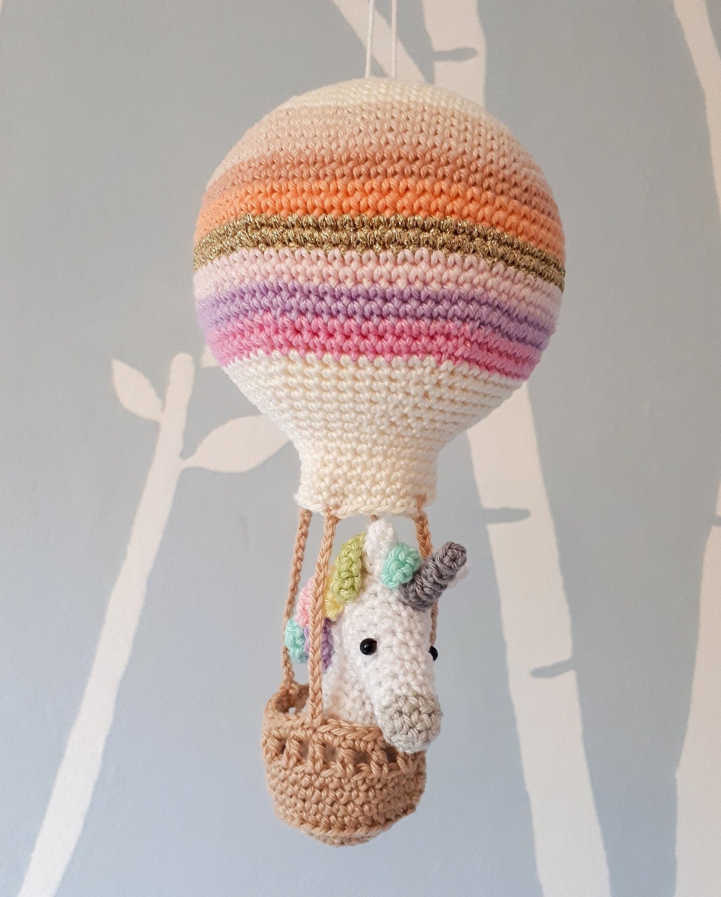 Crochet pattern amigurumi unicorn in a hot air balloon - Crochet on a tree