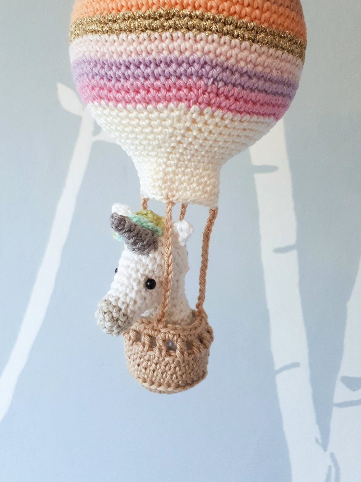 Crochet pattern amigurumi unicorn in a hot air balloon - Crochet on a tree