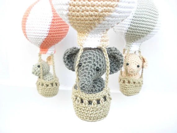 Peach hot air balloons baby mobile - Crochet on a tree